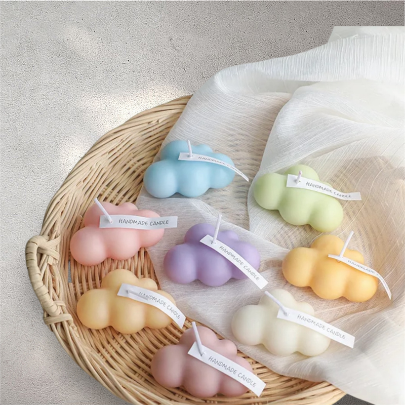 Pastel cloud shaped scented candles in blue, green, pink, purple, peach and yellow