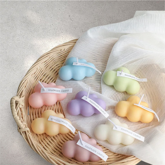 Pastel cloud shaped scented candles in blue, green, pink, purple, peach and yellow