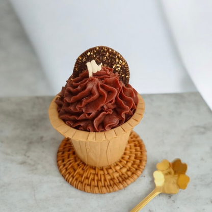 Chocolate swirl cupcake scented candle with a sandwich biscuit in a paper cup