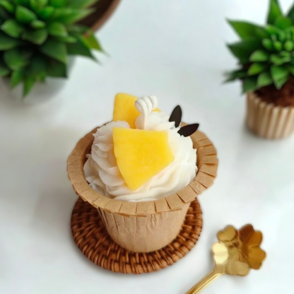 Vanilla swirl cupcake scented candle topped with mango pineapple pieces