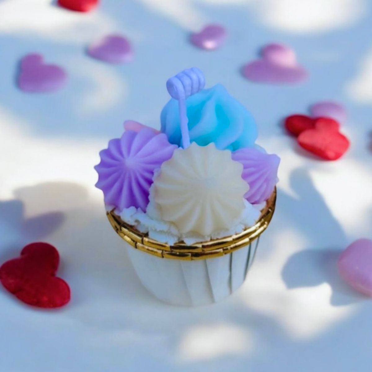 Cupcake scented candle with purple, blue and white swirl frosting