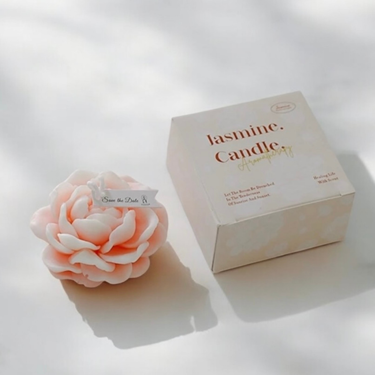 Light peach peony flower scented candle with gift box and orange blooms