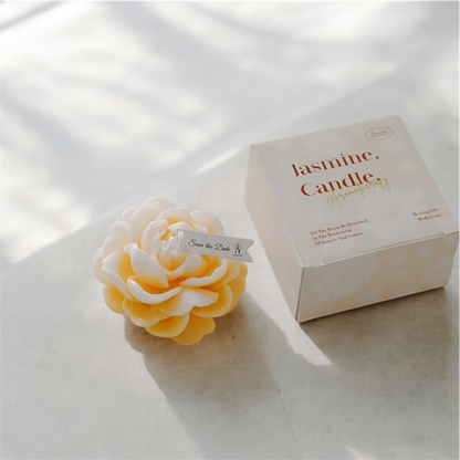 Yellow cream peony flower scented candle beside its Jasmine Candle gift box
