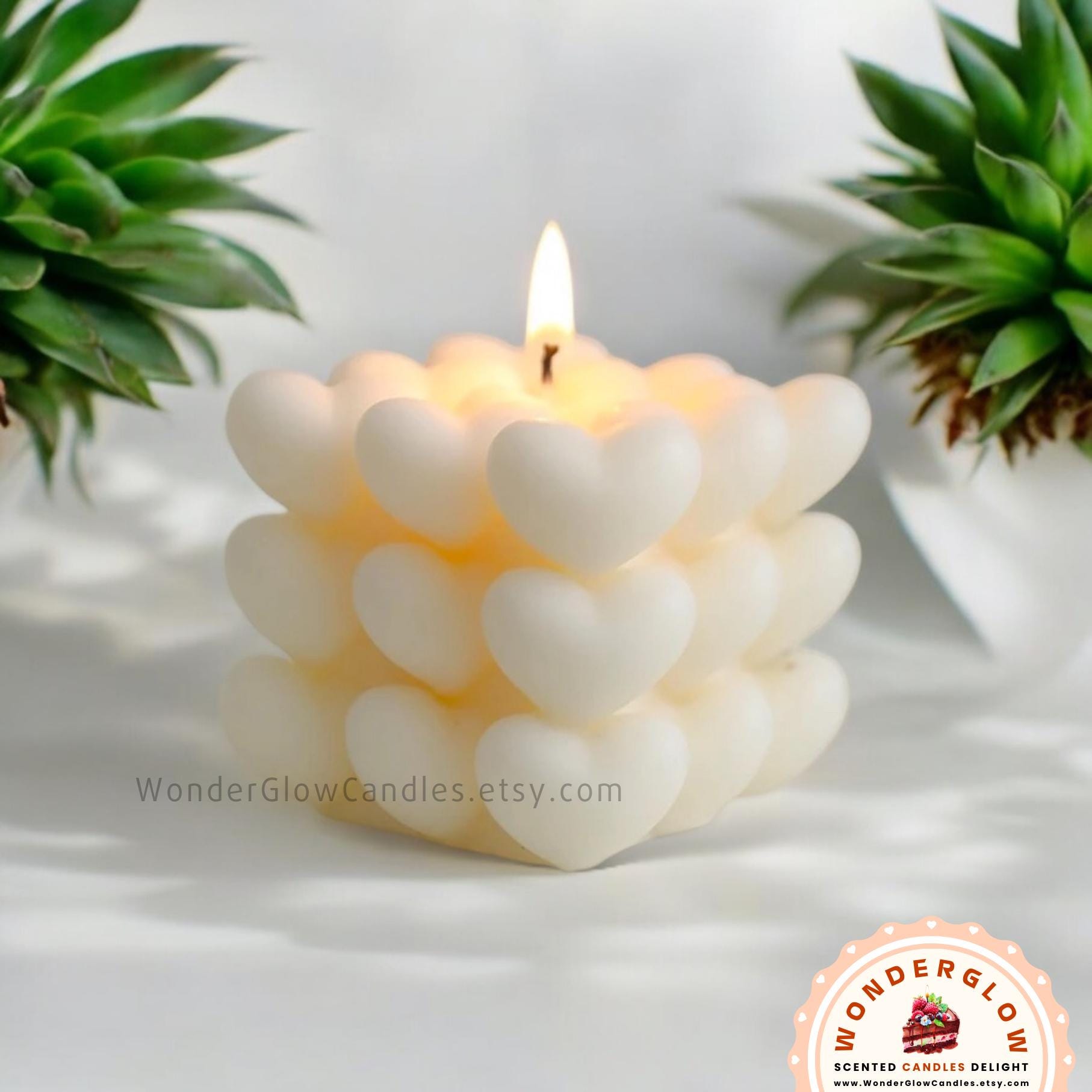 Heart scented candle shown lit