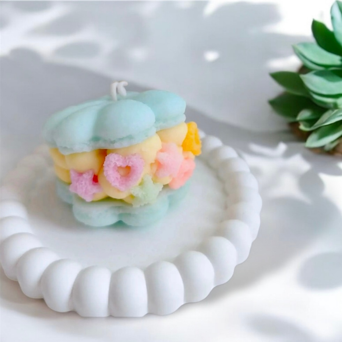 Baby blue macaron scented candle with pink and yellow star filling