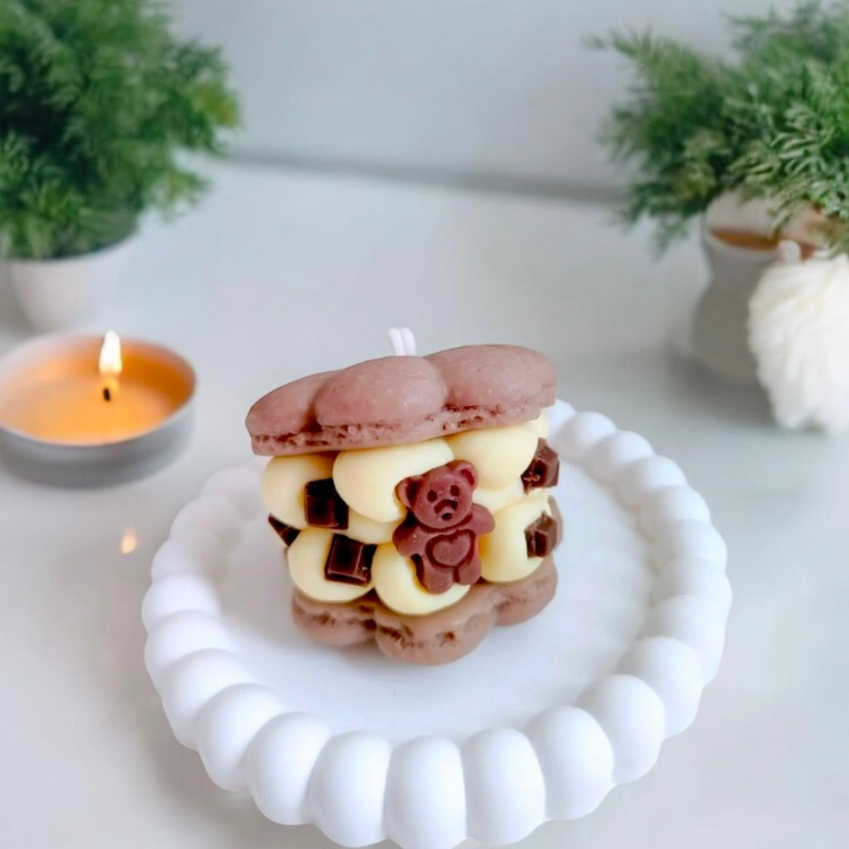Chocolate macaron scented candle with a teddy bear and chocolate squares