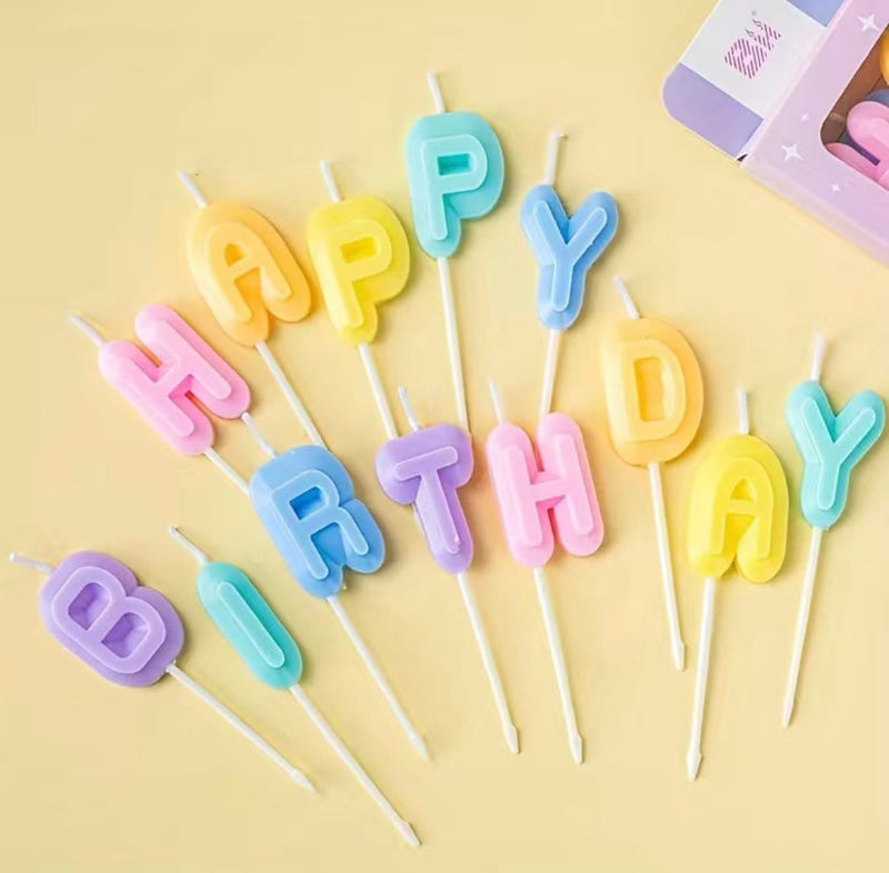 Multicolor birthday candles styled for a birthday party
